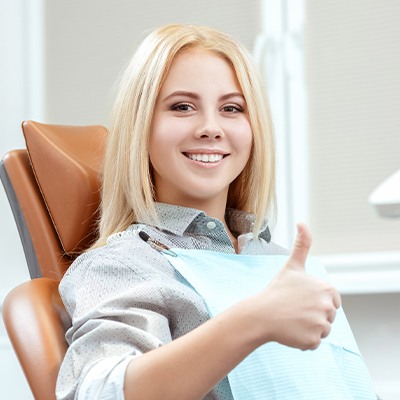 blonde girl doing thumbs up