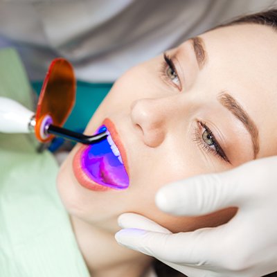 woman getting dental sealant