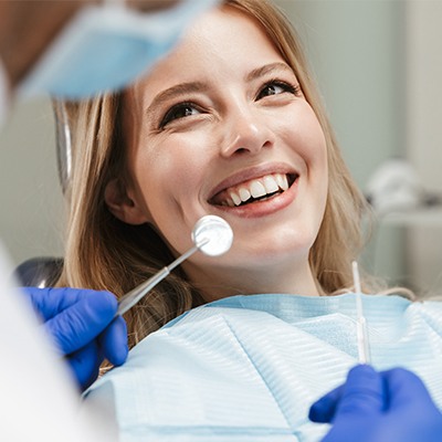 blonde girl smiling at dentist