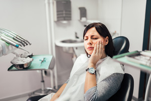 Woman with a toothache at the dentist’s office